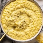 creamed corn in bowl with fresh black pepper