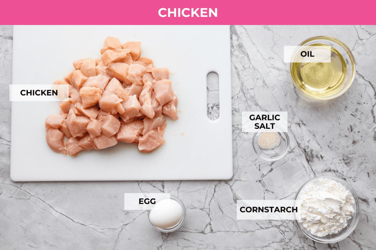 Overhead shot of labeled sticky apricot chicken ingredients. 