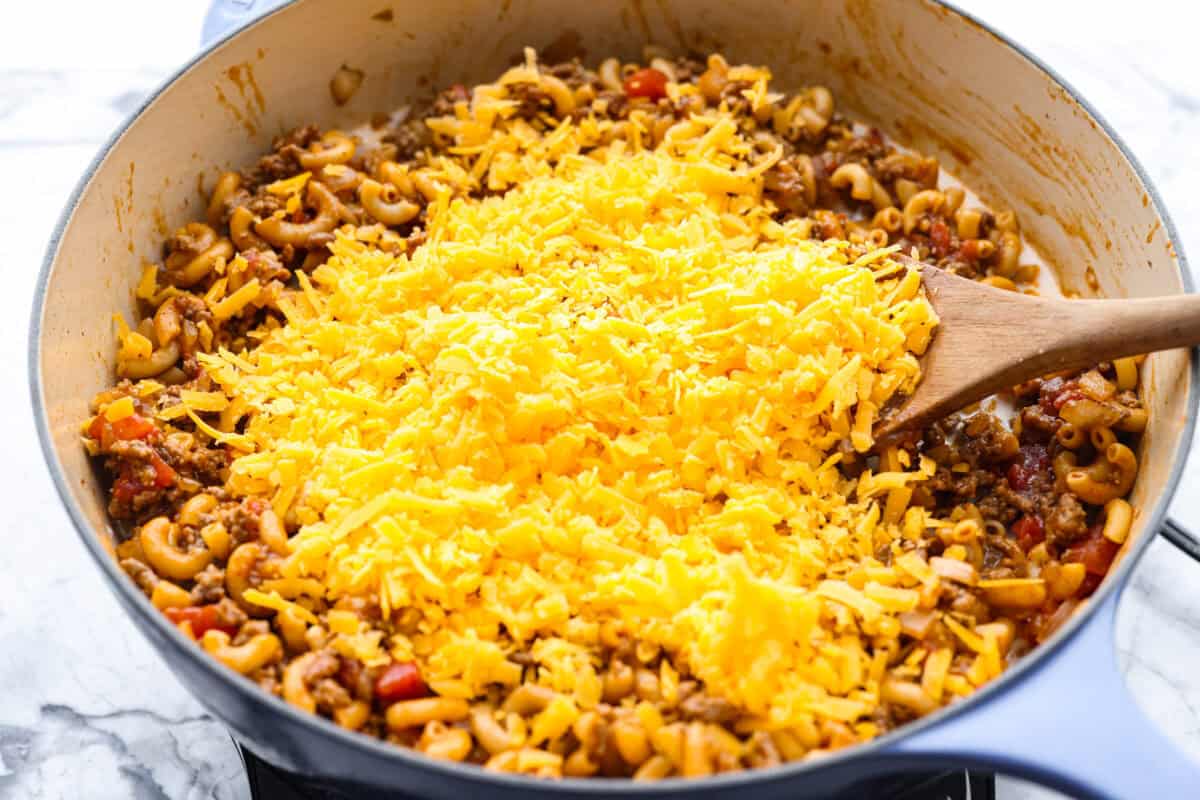 Cheese added to the cooked down  beef and noodle mixture. 