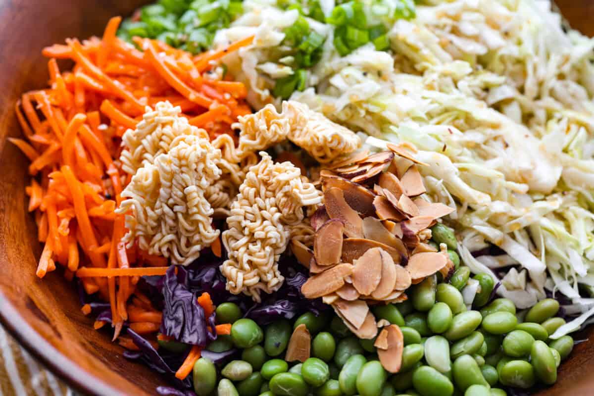 Toasted noodles and almonds added to the bowl.