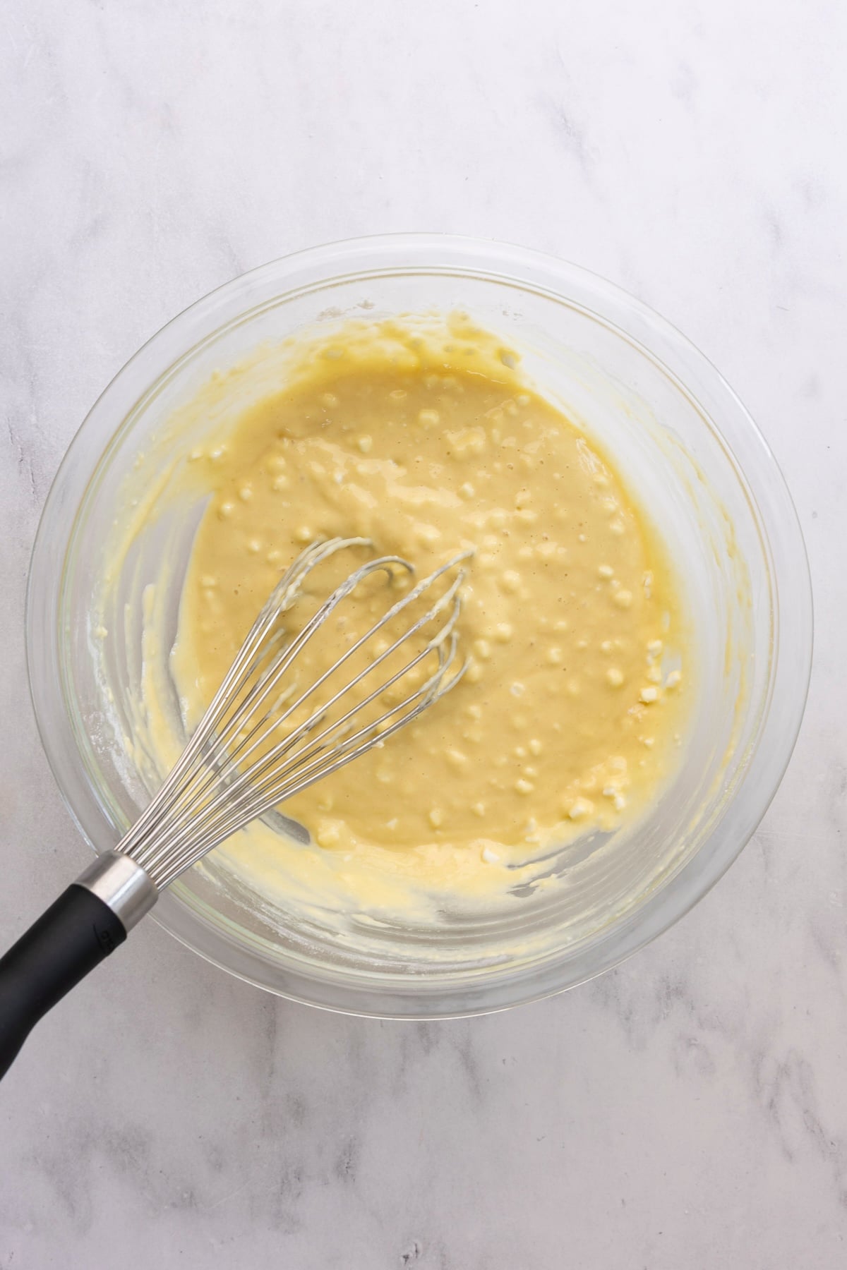 medium bowl with fully mixed pancake batter