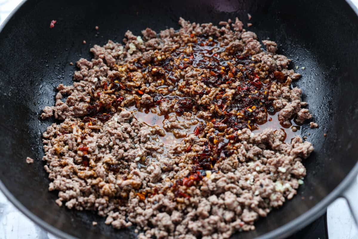 Sauce added to the ground beef in the skillet. 