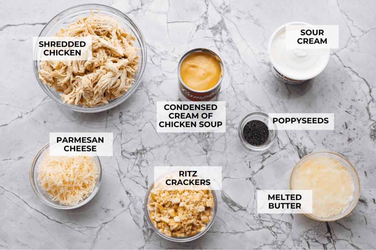 Overhead shot of labeled poppy seed chicken casserole ingredients. 