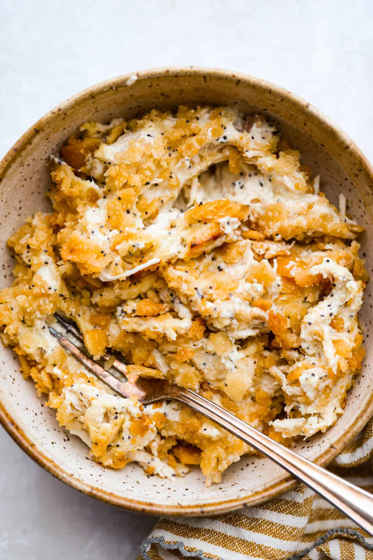 Serving of poppy seed chicken casserole in a bowl. 