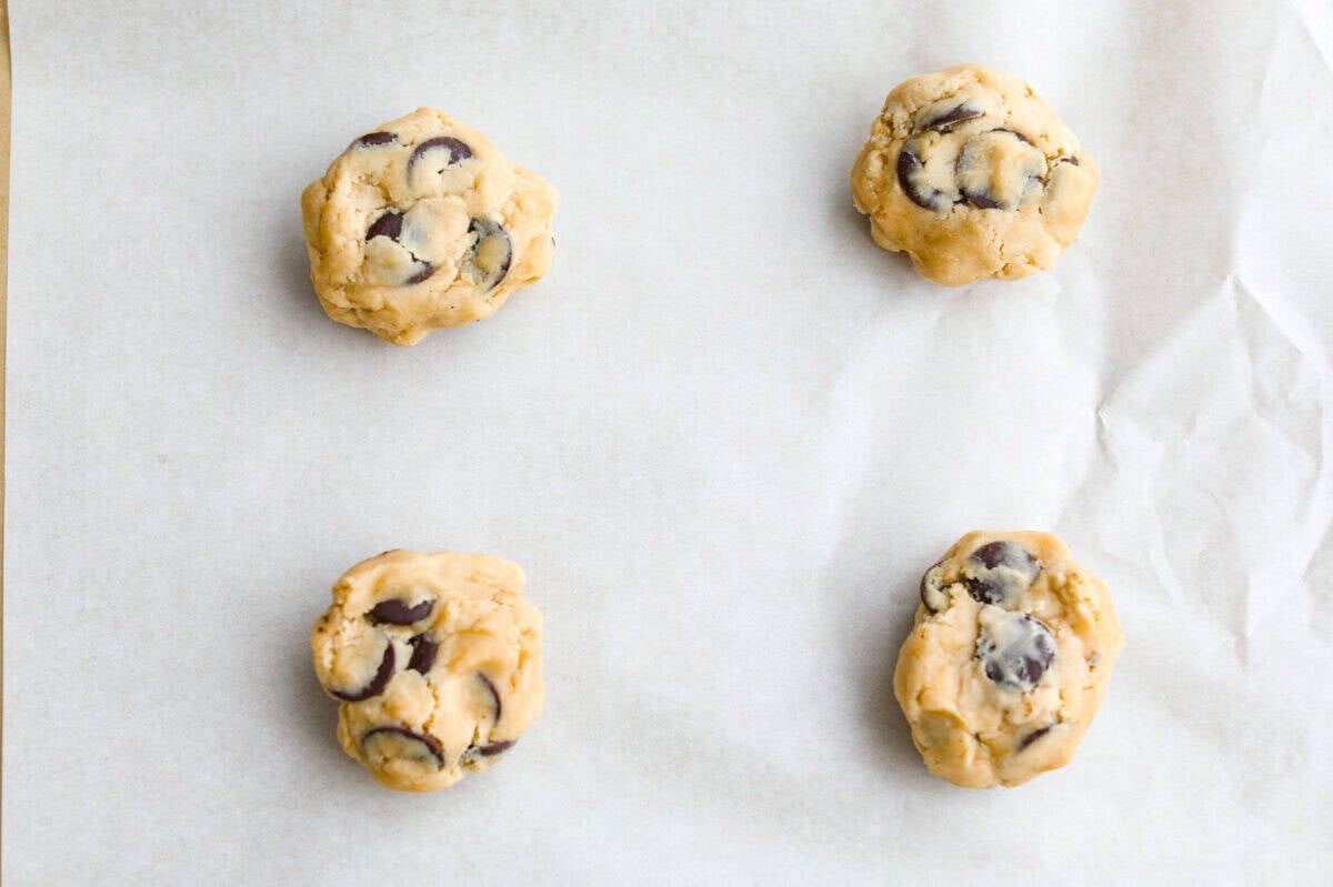 Each cookie dough bal l place on the cookie sheet.