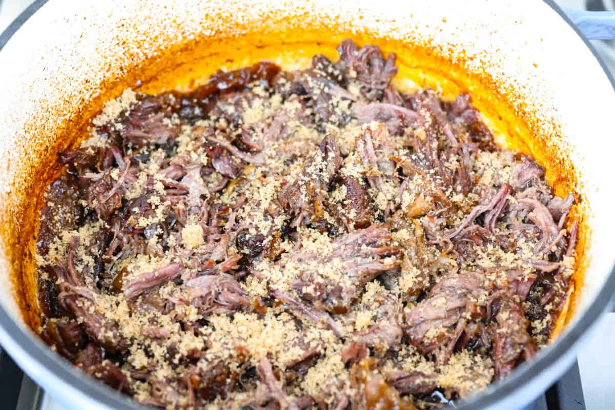 Beef shredded and brown sugar added to the top.