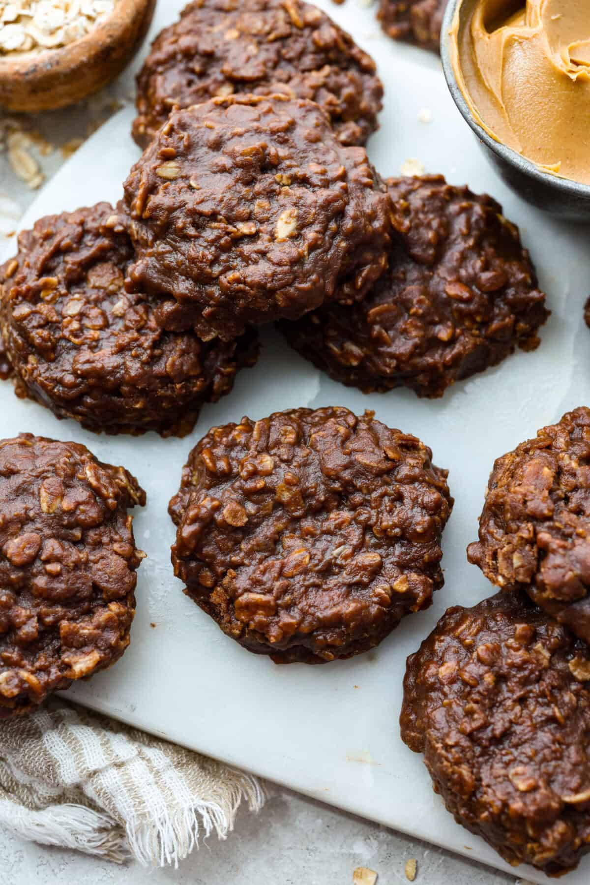 No bake cookies set and spread out on a cookies sheet. 