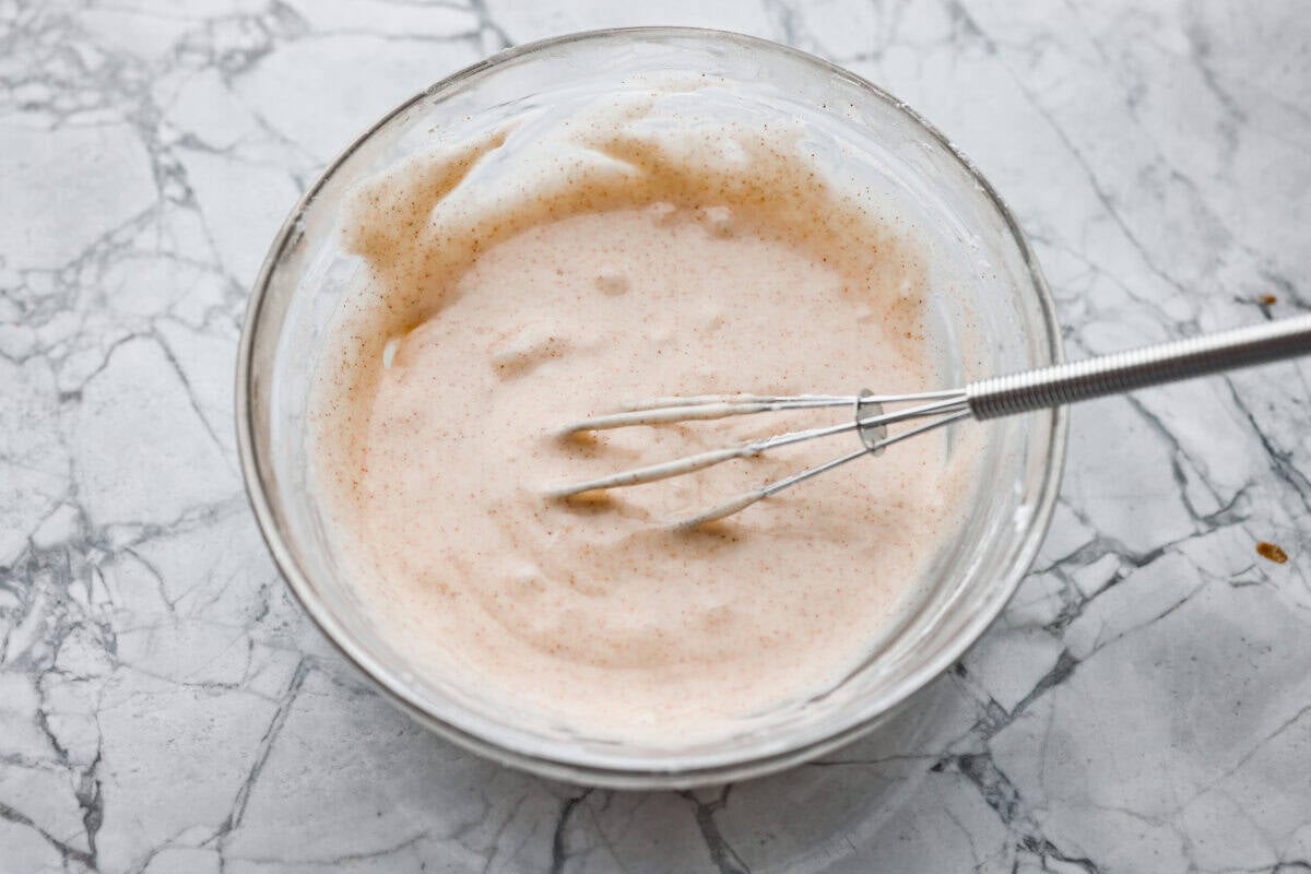 Glaze ingredients added to a mixing bowls and whisked together. 