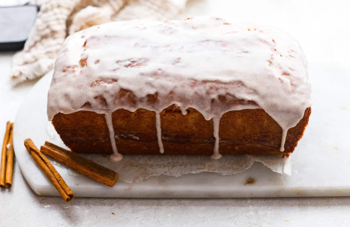 Glaze poured over the top of the snickerdoodle donut loaf. 