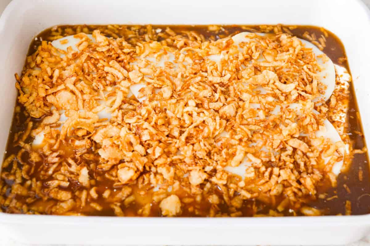 Provolone cheese and crispy fried onion s added on top of the chicken breasts.