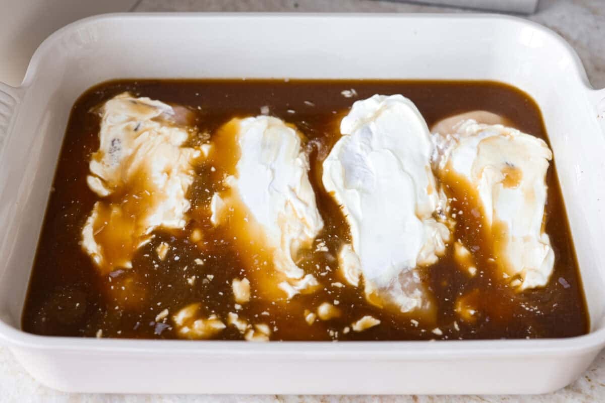 Sour cream spread over the chicken breasts. 