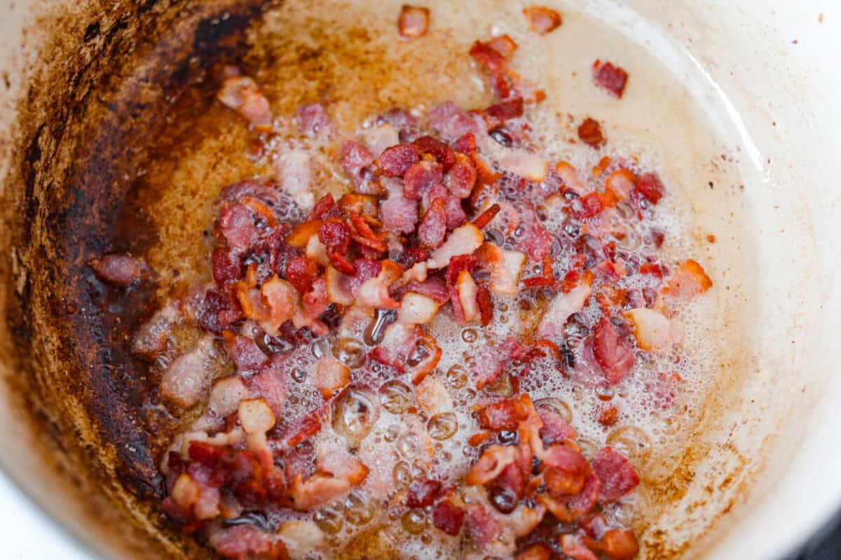 Bacon cooking in a pot. 