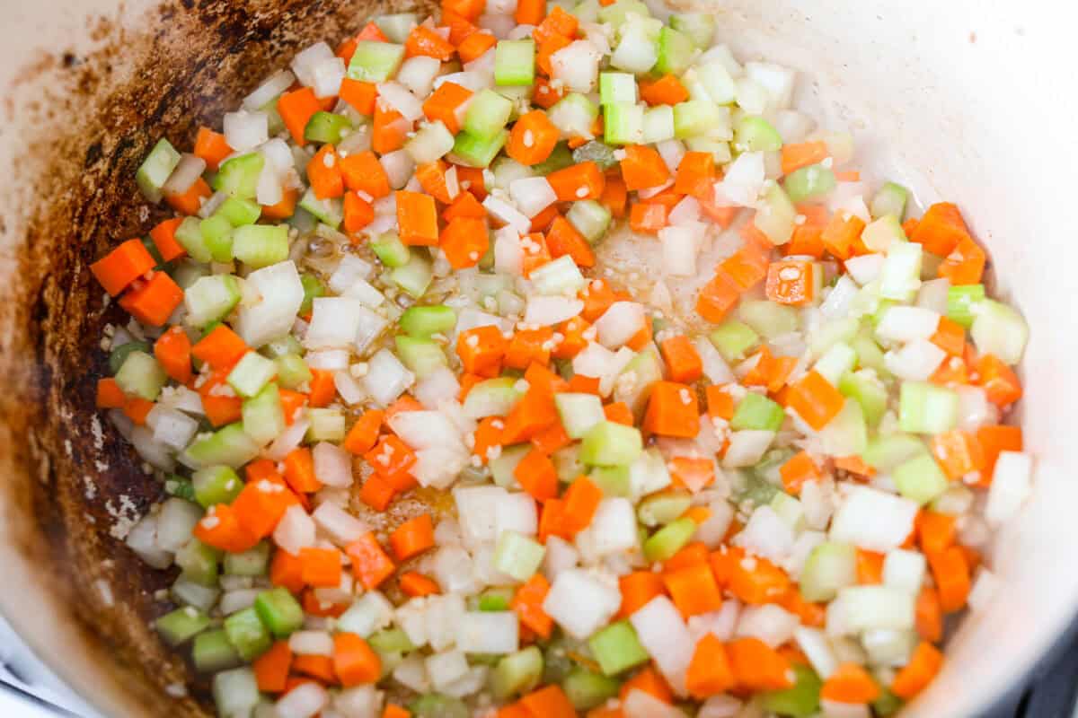 Carrot, onion, celery and garlic cooking in the bacon grease. 