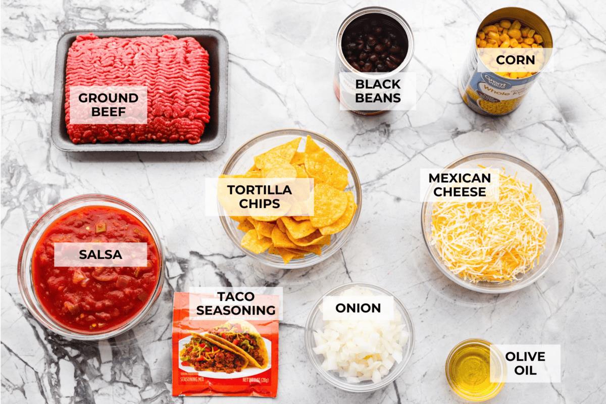 Overhead shot of labeled taco casserole ingredients. 