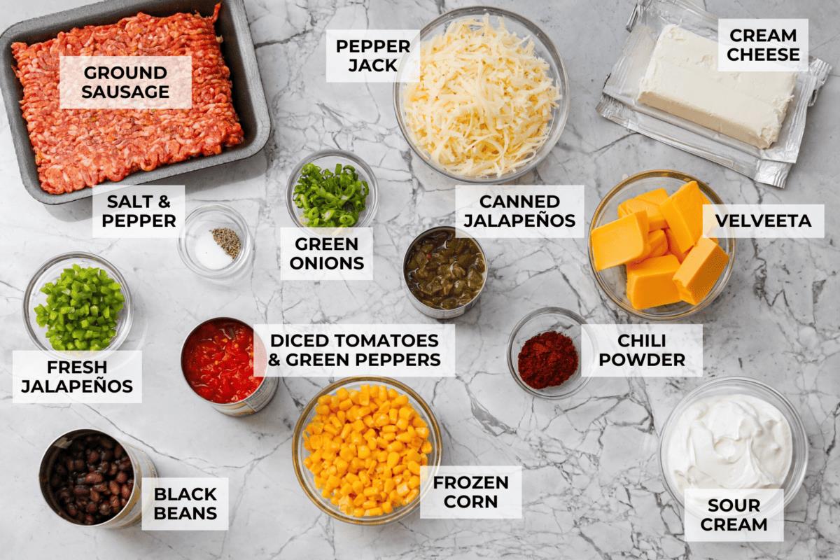 Overhead shot of labeled hot cowboy dip ingredients. 