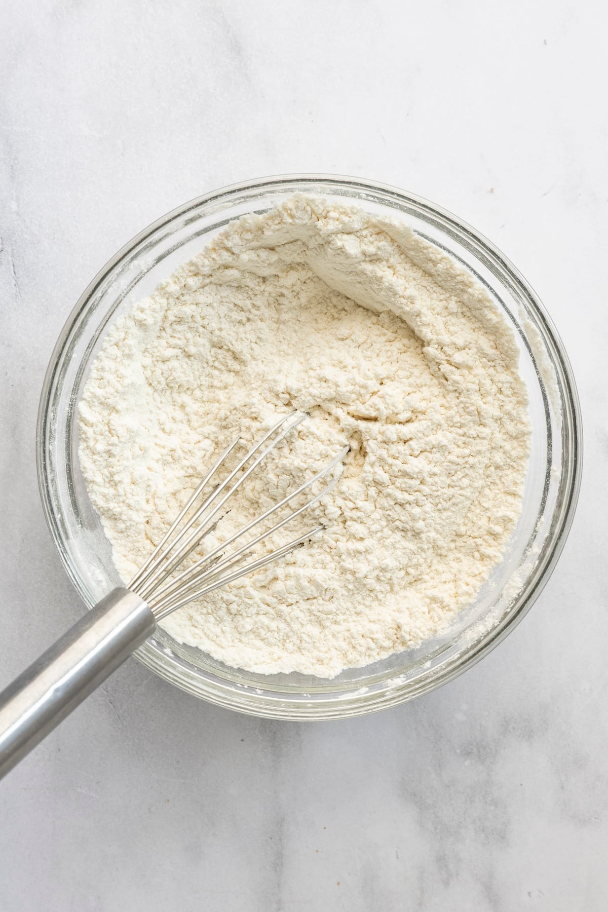 medium bowl with flour, salt, baking soda, and baking powder combined