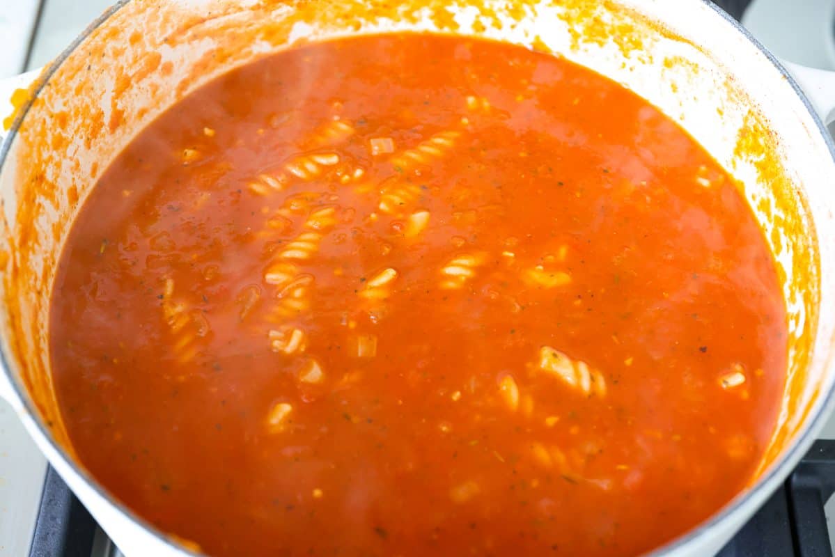 Pasta added to the pot to cook. 