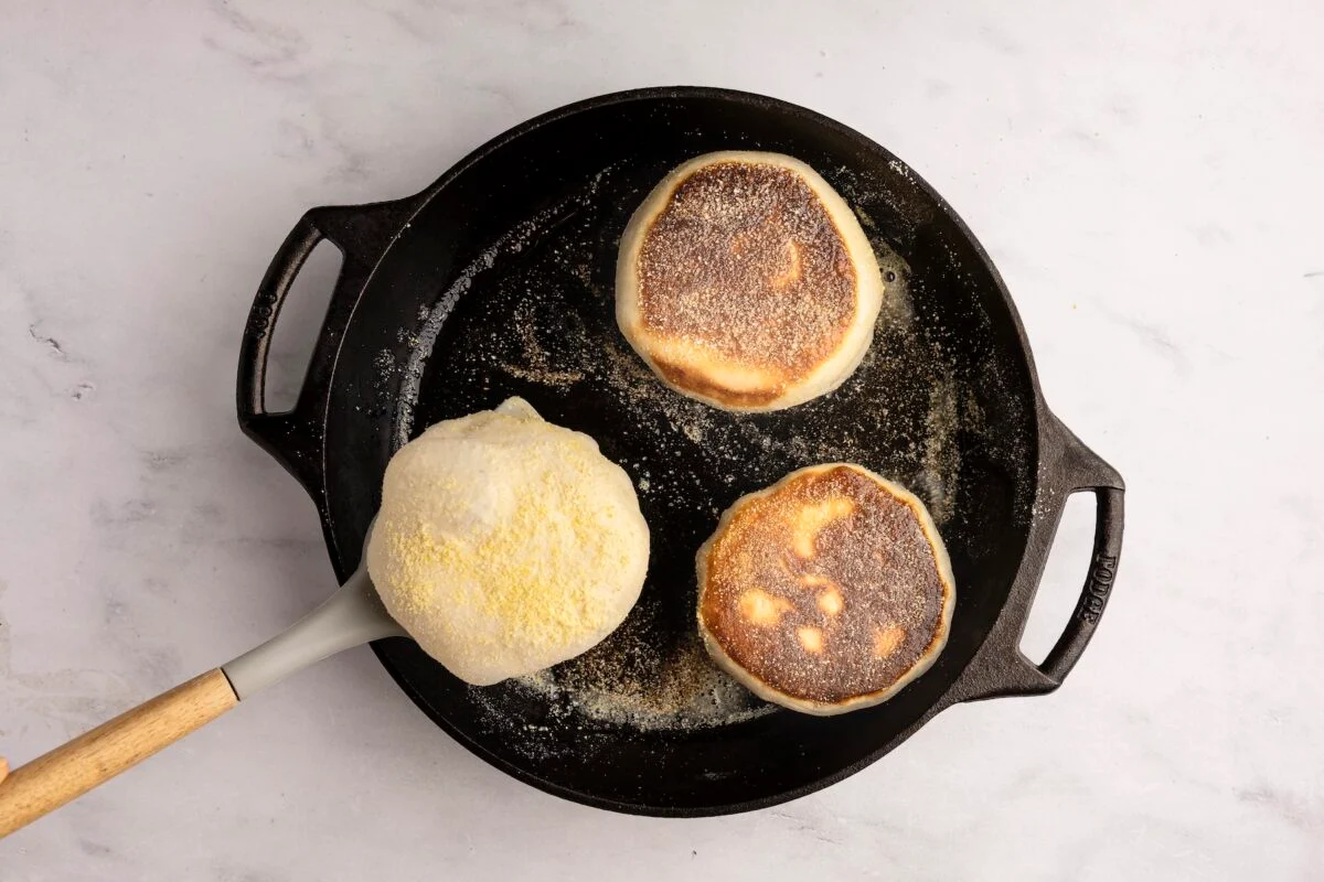 Cooking English muffins in skillet.