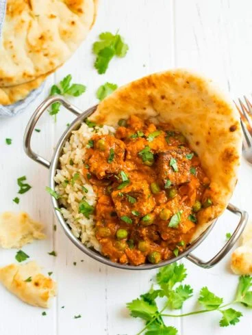 Creamy Tandoori Tofu Tikka Masala on rice with naan bread