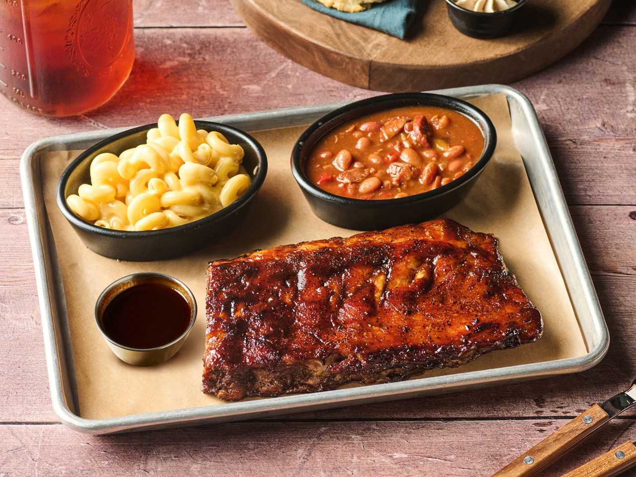 Lucille's Smokehouse Bar-B-Que Black Garlic BBQ Baby Back Ribs Lucille's Smokehouse Bar-B-Que Unveils 'Black Gold': Its First New BBQ Sauce in Over Five Years